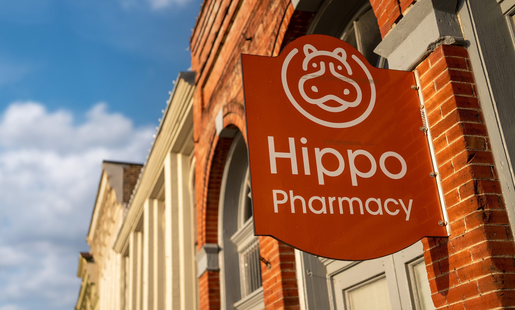 Photo of Hippo Pharmacy sign on storefront.