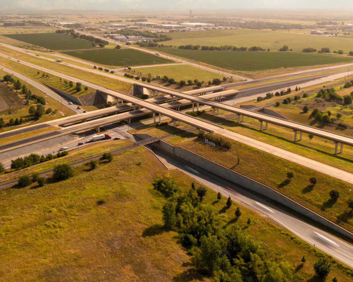 Aerial view of highway overpass with Hutto sign
